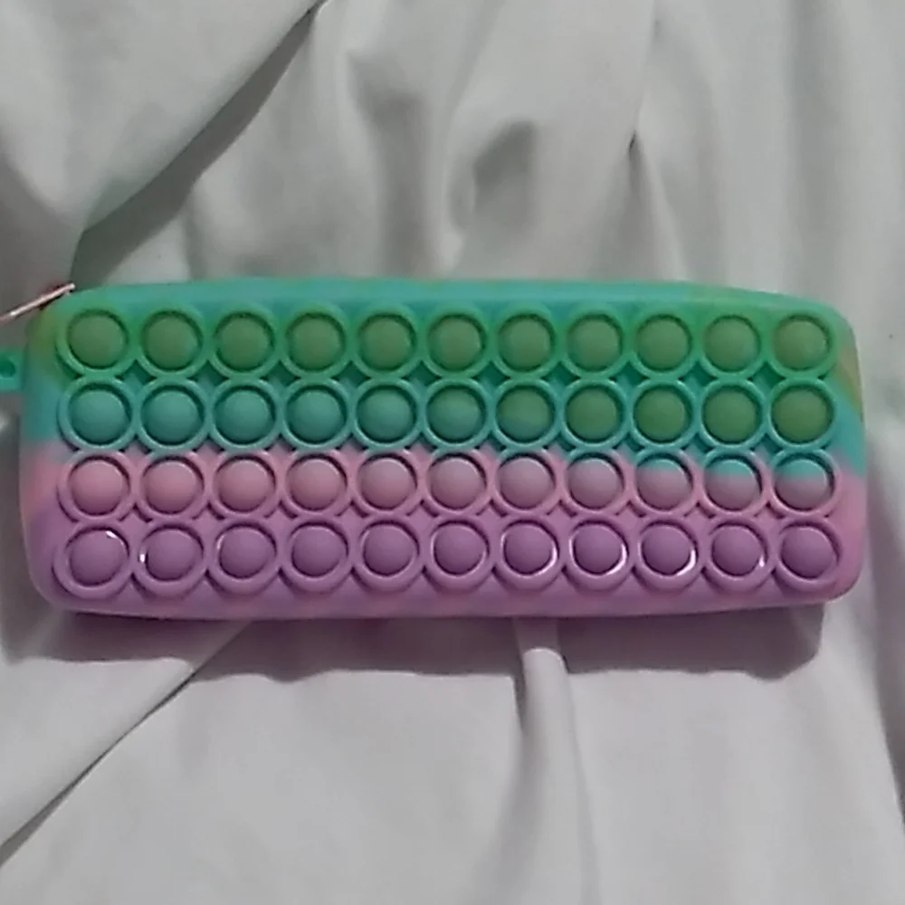 8 x 3 x 1 1/4 inches Purple, pink & green Pop It Case